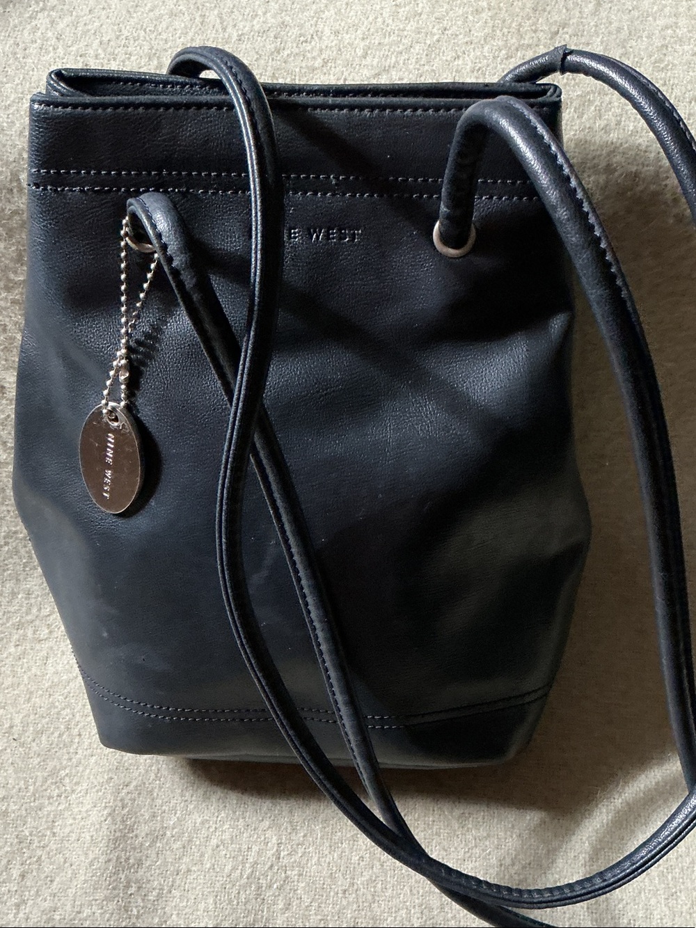 Nine West Black Leather Drawstring Bucket Crossbody with Charm Accent